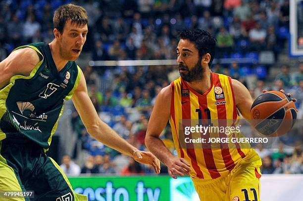 Unicaja's center Fran Vazquez vies with Barcelona's guard Juan Carlos Navarro during the Euroleague group E TOP 16 basketball match Unicaja Malaga vs...