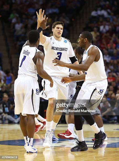 Austin Chatman, Doug McDermott and Jahenns Manigat of the Creighton Bluejays celebrate after a play in the second half against the Louisiana...