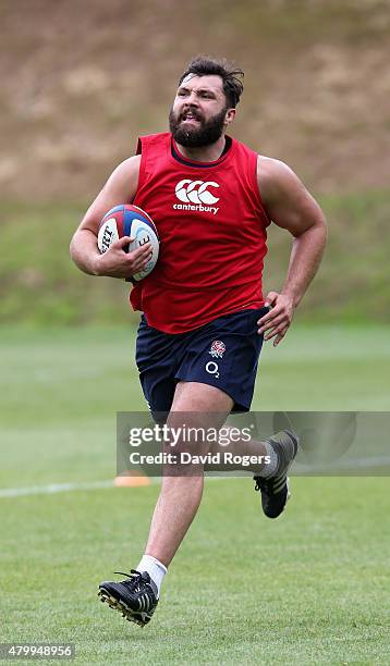 Alex Corbisiero runs with the ball during the England training session held at Pennyhill Park on July 8, 2015 in Bagshot, England.