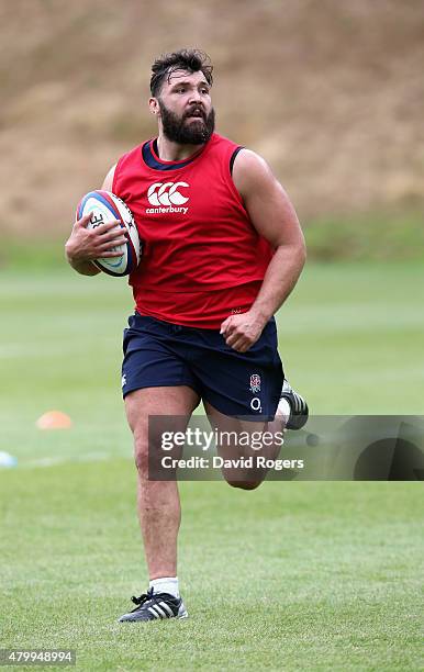 Alex Corbisiero runs with the ball during the England training session held at Pennyhill Park on July 8, 2015 in Bagshot, England.