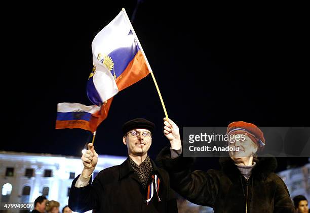 Pro-russian people gather at the Lenin Square, in Simferopol to celebrate after the Association Agreement signed on the sidelines of an EU summit in...