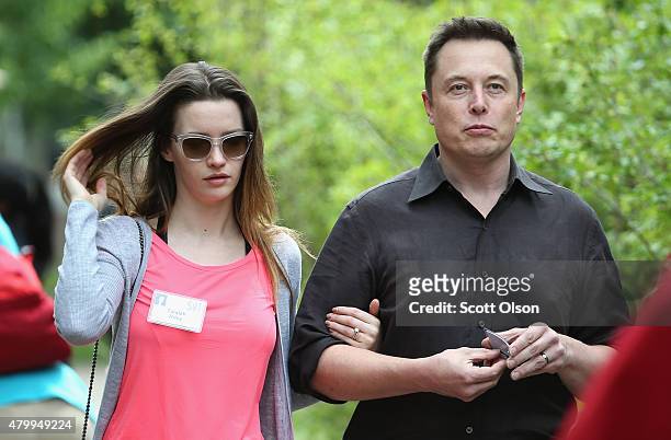 Elon Musk, CEO and CTO of SpaceX, CEO and product architect of Tesla Motors, and chairman of SolarCity, and his wife Talulah Riley attend the Allen &...