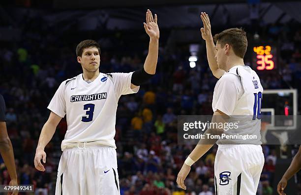 Doug McDermott and Grant Gibbs of the Creighton Bluejays celebrate after a play in the second half against the Louisiana Lafayette Ragin Cajuns...