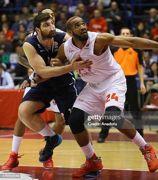 Emporio Armani' Samuels Samardo in action against Anadolu Efes' Deniz Kilicli during the Turkish Airlines Euroleague Top 16 Round 11 basketball match...