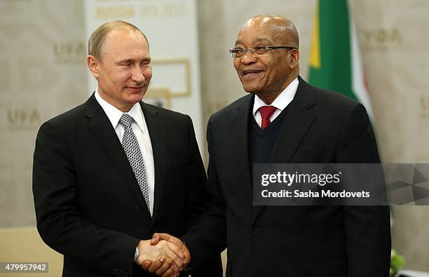 Russian President Vladimir Putin greets South African President Jacob Zuma during their bilateral meeting at the BRICS 2015 Summit on July 8, 2015 in...