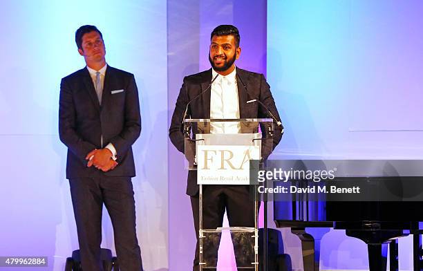 Ahmed Khan speaks as host Vernon Kay looks on at the Fashion Retail Academy 10th Anniversary Awards at Freemasons' Hall on July 8, 2015 in London,...