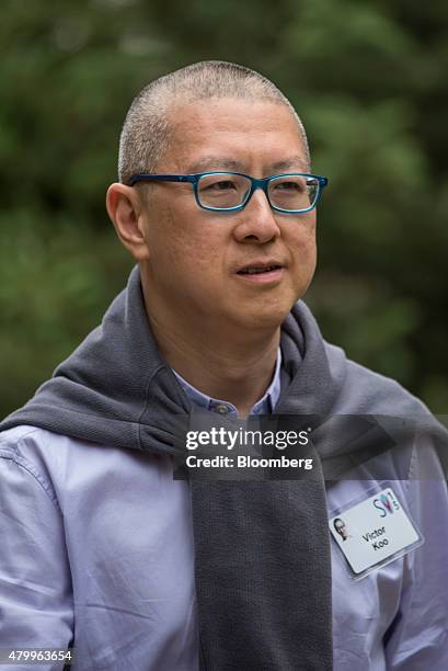 Victor Koo, chairman and chief executive officer of Youku Tudou Inc., walks the grounds after a morning session during the Allen & Co. Media and...