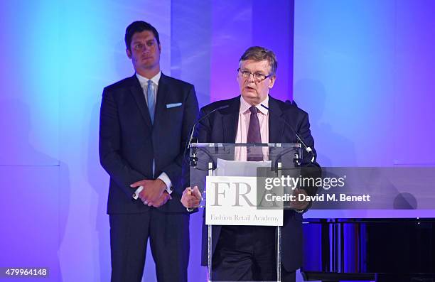 Richard Boland speaks as host Vernon Kay looks on at the Fashion Retail Academy 10th Anniversary Awards at Freemasons' Hall on July 8, 2015 in...