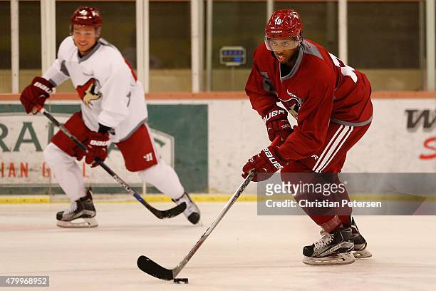 Anthony Duclair of the Arizona Coyotes skates alongside Maxi Domi as they participant in the prospect development camp at the Ice Den on July 8, 2015...