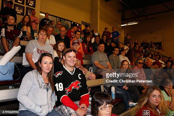 Fans watch as Arizona Coyotes propects participant in the development camp at the Ice Den on July 8, 2015 in Scottsdale, Arizona.