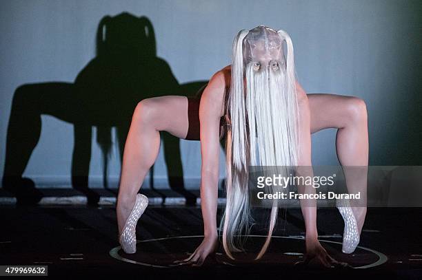 Model performs on stage during the Charlie Le Mindu show as part of Paris Fashion Week Haute Couture Fall/Winter 2015/2016 on July 8, 2015 in Paris,...
