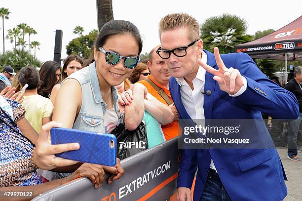 Mark McGrath takes a selfie with a fan at "Extra" at Universal Studios Hollywood on July 8, 2015 in Universal City, California.