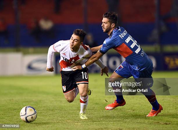 Gonzalo Martinez of River Plate fights for the ball with Ernesto Goñi of Tigre during a match between Tigre and River Plate as part of 13th round of...