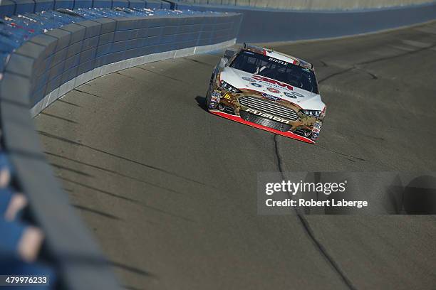 Greg Biffle drives the 3M Aerospace Ford during qualifying for the NASCAR Sprint Cup Series Auto Club 400 at Auto Club Speedway on March 21, 2014 in...