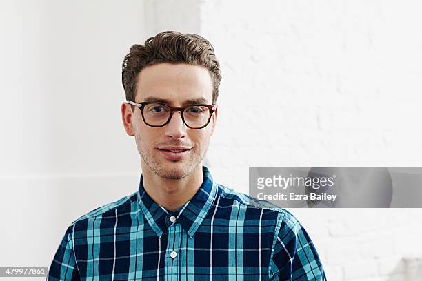 portrait of a young creative man. - occhiali a montatura spessa foto e immagini stock
