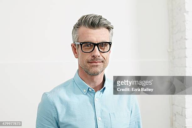 portrait of a successful man in an office. - only men stock pictures, royalty-free photos & images