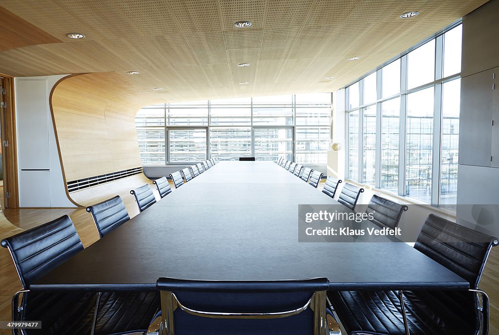 View over huge table in designed meeting room