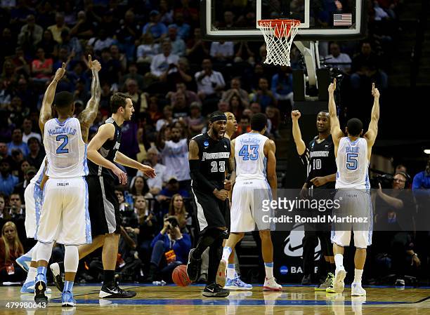 LaDontae Henton of the Providence Friars reacts after James Michael McAdoo of the North Carolina Tar Heels hit a free throw during the closing...