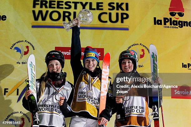 Third place Maxime Dufour-Lapointe of Canada, first place Hannah Kearney of the USA with the Overall Freestyle World Cup globe and second place...