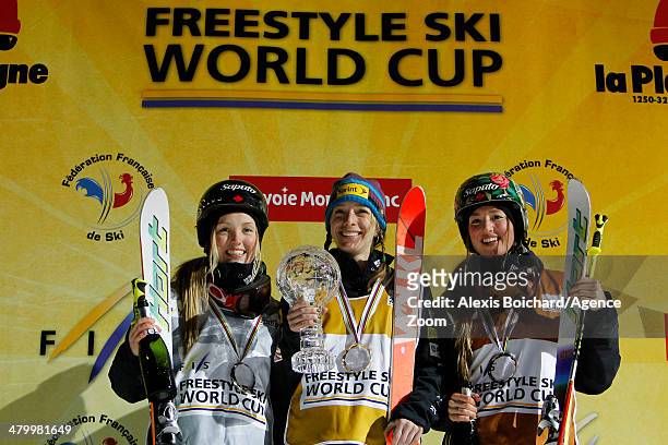 Third place Maxime Dufour-Lapointe of Canada, first place Hannah Kearney of the USA with the Overall Freestyle World Cup globe and second place...