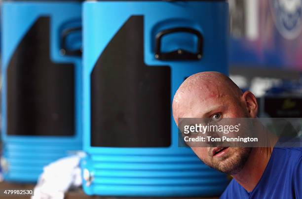 Matt Harrison of the Texas Rangers looks on in the dugout against the Arizona Diamondbacks in the bottom of the second inning at Globe Life Park in...