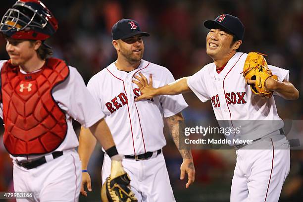 Koji Uehara of the Boston Red Sox celebrates with Mike Napoli after the game against the Miami Marlins at Fenway Park on July 8, 2015 in Boston,...