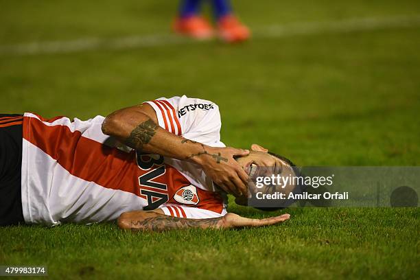 Leonel Vangioni of River Plate goes down injured during a match between Tigre and River Plate as part of 13th round of Torneo Primera Division 2015...