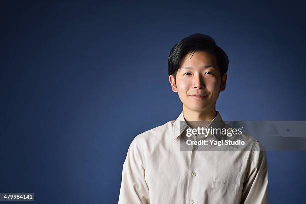 portrait of man,japan - asian man studio shot photos et images de collection