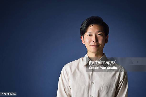 portrait of man,japan - blue background portrait bildbanksfoton och bilder