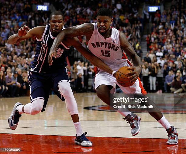 Thunder's Kevin Durant reaches in on a driving Amir Johnson of the Raptors. Toronto Raptors vs Oklahoma Thunder during 2 OT period action of NBA play...