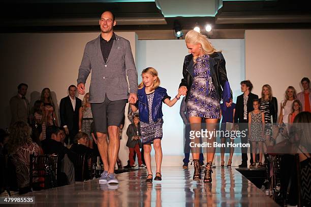 Hockey player Ryan Getzlaf, Audrey Sugden, and Paige Getzlaf attend the Anaheim Lady Ducks Fashion Show Luncheon with Bloomingdale's South Coast...