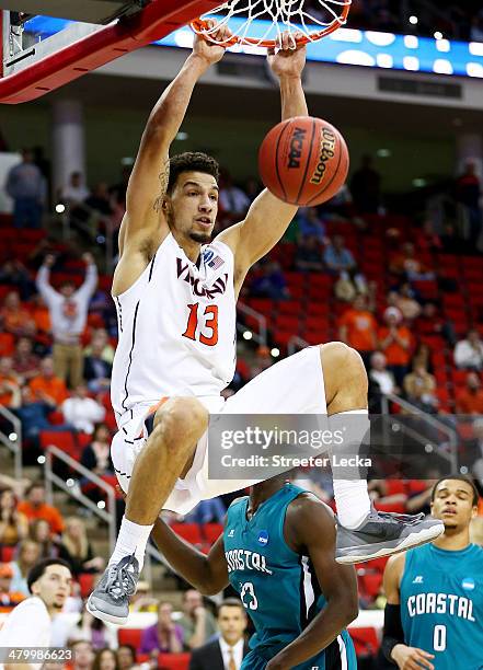 Anthony Gill of the Virginia Cavaliers dunks against the Coastal Carolina Chanticleers in the second half during the Second Round of the 2014 NCAA...