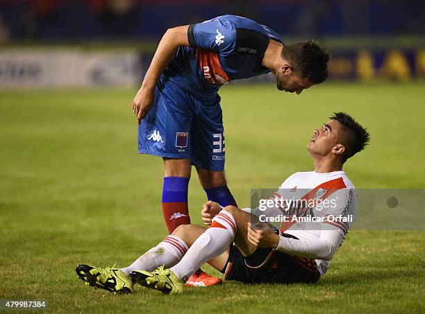 Ernesto Goñi of Tigre and Gonzalo Martinez of River Plate argue during a match between Tigre and River Plate as part of 13th round of Torneo Primera...