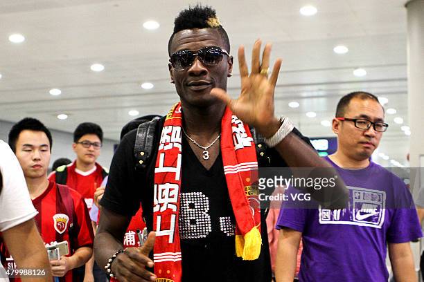 Ghana's striker Asamoah Gyan arrives at Pudong International Airport on July 8, 2015 in Shanghai, China. Asamoah Gyan will sign a contract with...