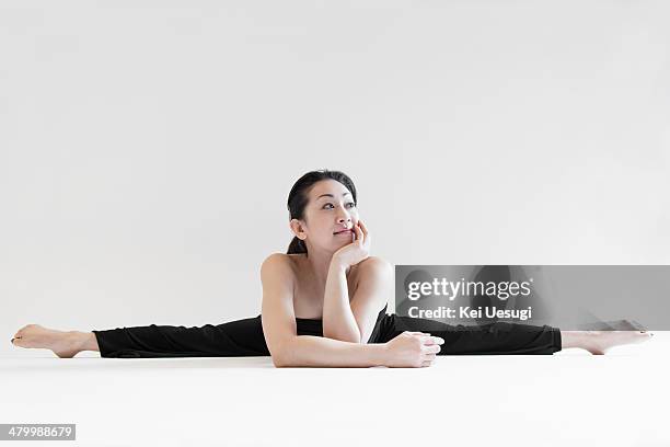 a portrait of yoga woman. - doing the splits stock pictures, royalty-free photos & images