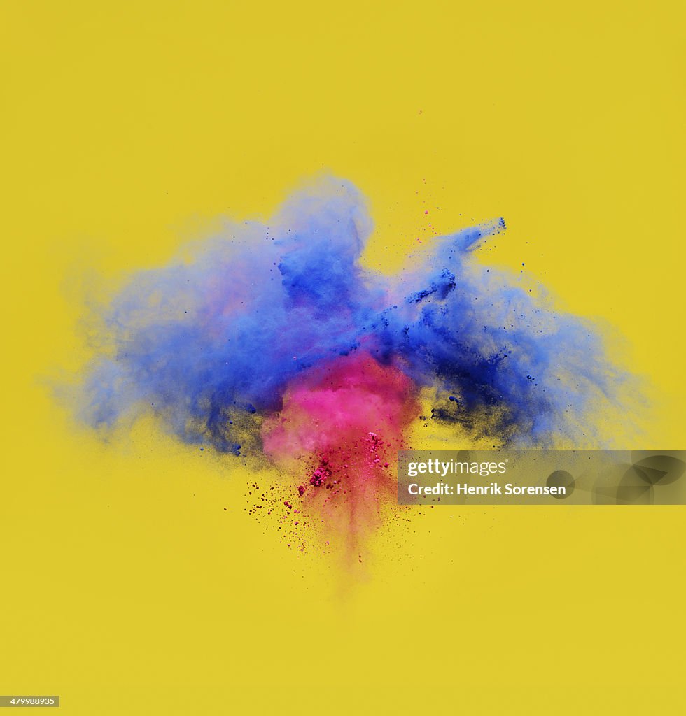 Explosion of pink and blue powder
