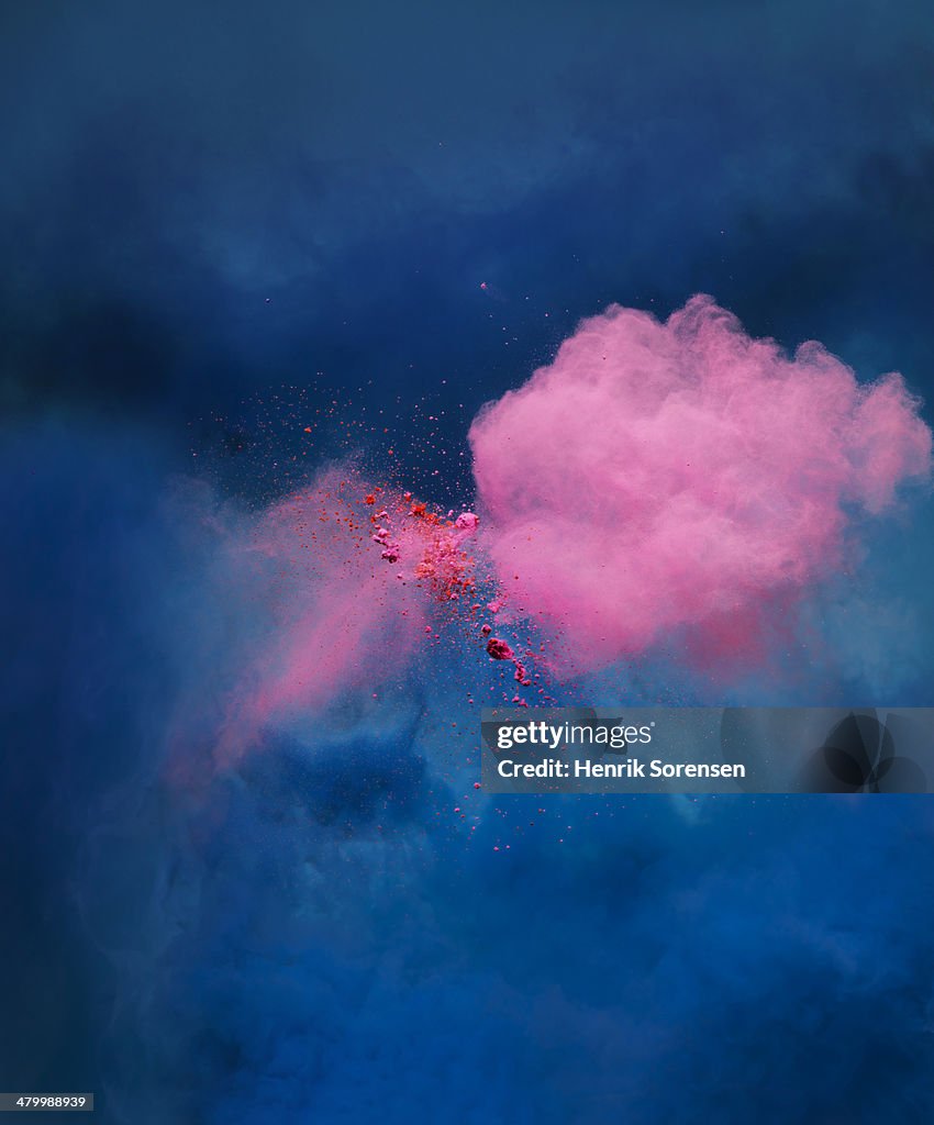 Explosion of pink colored powder