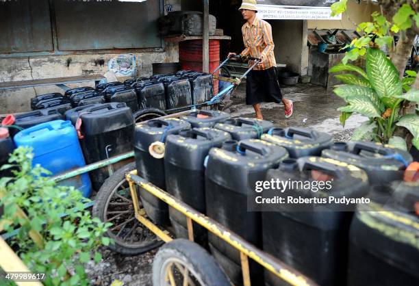 Man peddles clean water on World Water Day March 22, 2014 in Surabaya, Indonesia. World Water Day recognizes the global need for water and energy...