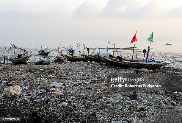 The scattered plastic trash brought in by strong waves seen at Kenjeran Beach on World Water Day March 22, 2014 in Surabaya, Indonesia. World Water...