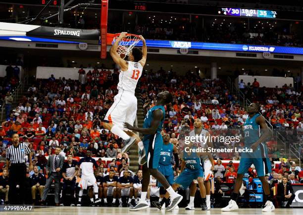 Anthony Gill of the Virginia Cavaliers dunks against the Coastal Carolina Chanticleers during the Second Round of the 2014 NCAA Basketball Tournament...