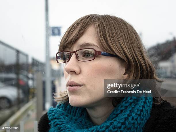 red haired young woman at a small train station - details geel stock pictures, royalty-free photos & images