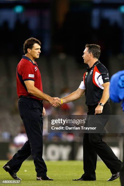 Melbourne coach Paul Roos and St Kilda coach Alan Richardson shake hands before the round one AFL match between the St Kilda Saints and the Melbourne...