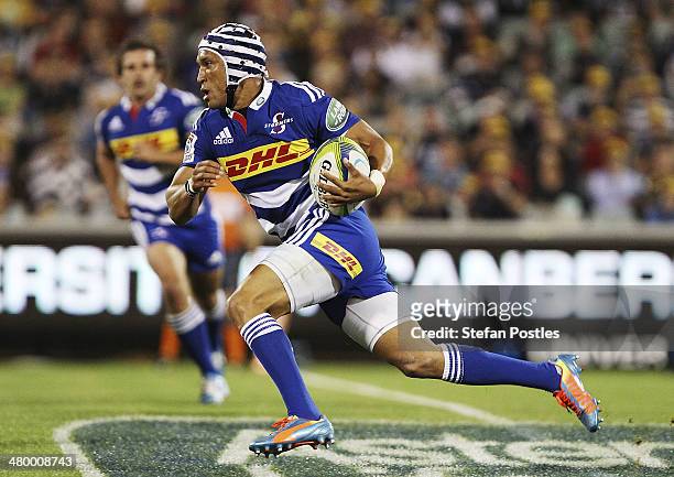 Gio Aplon of the Stormers runs the ball during the round six Super Rugby match between the Brumbies and the Stormers at Canberra Stadium on March 22,...