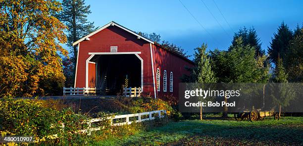 shimanek covered bridge, with autumn foliage - autumn covered bridge stock pictures, royalty-free photos & images