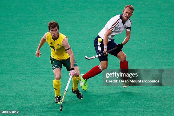 Fergus Kavanagh of Australia battles for the ball with Dan Fox of Great Britain during the Fintro Hockey World League Semi-Final match between...