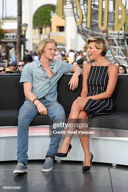 Cody Simpson and Charissa Thompson visit "Extra" at Universal Studios Hollywood on July 8, 2015 in Universal City, California.