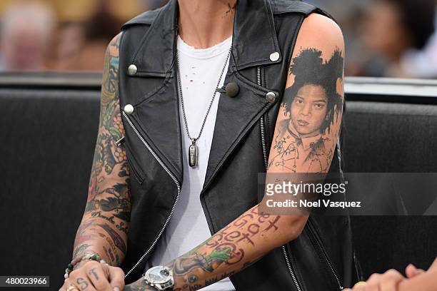 Ruby Rose, tattoo detail, visits "Extra" at Universal Studios Hollywood on July 8, 2015 in Universal City, California.