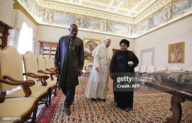 Pope Francis meets with Nigerian President Goodluck Jonathan and his wife Patience during a private audience at the Vatican on March 22, 2014. AFP...