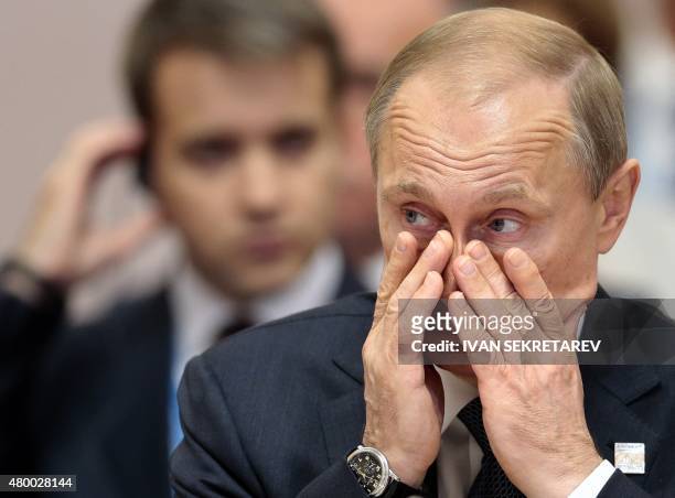 Russia's President Vladimir Putin attends a working session at the 7th BRICS summit in Ufa on July 9, 2015. Leaders of the BRICS group of emerging...