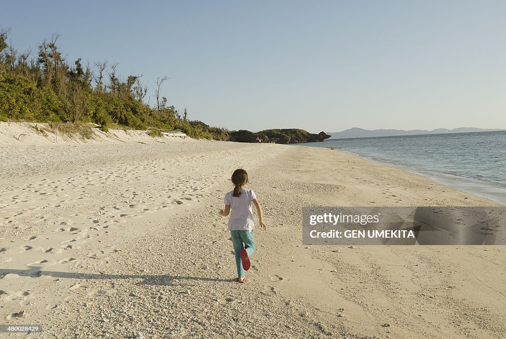 A girl who run on the beach